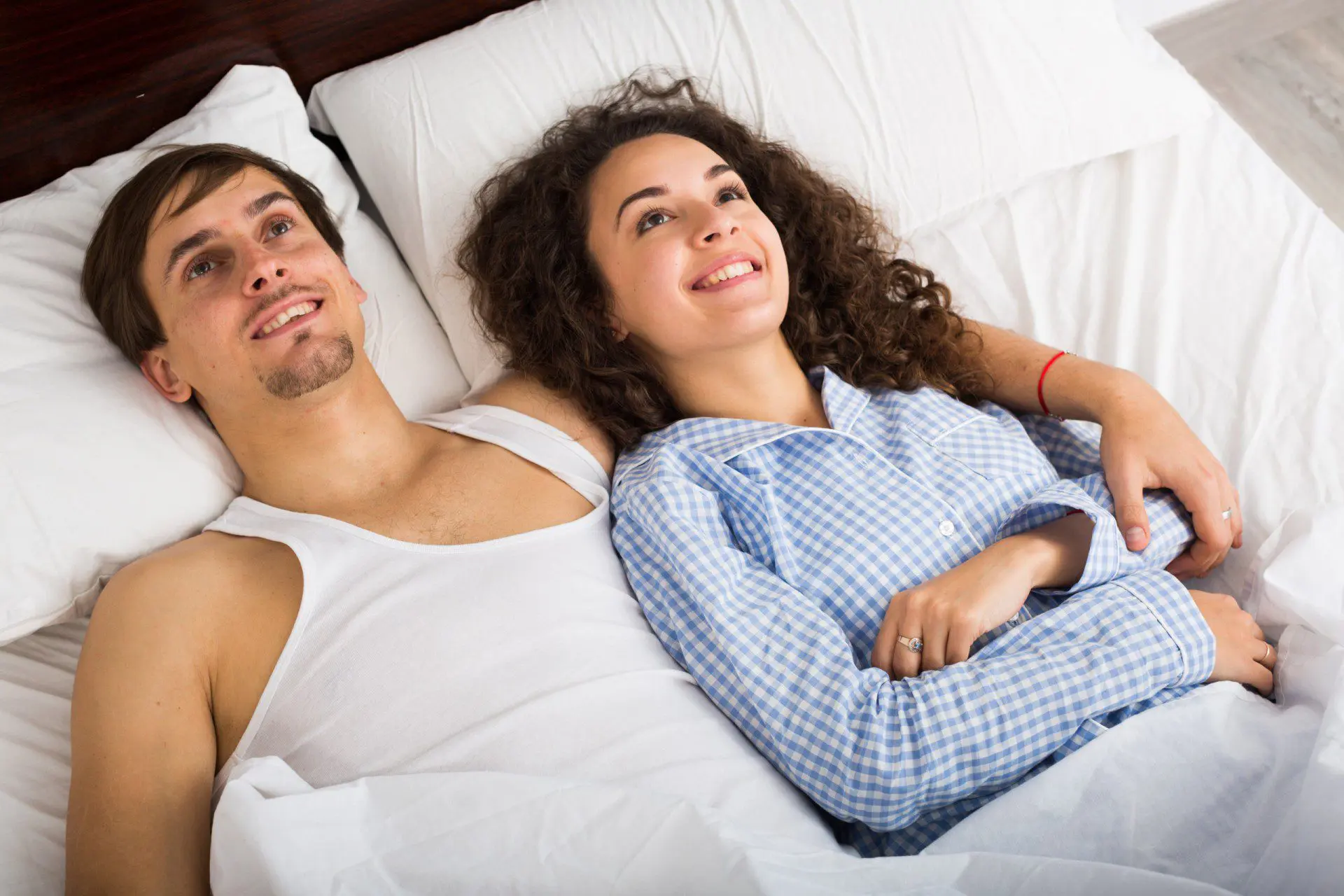 Couple in bed after sex